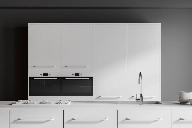 istock Dark home kitchen interior with bar island, cooking cabinet and oven 2181593580