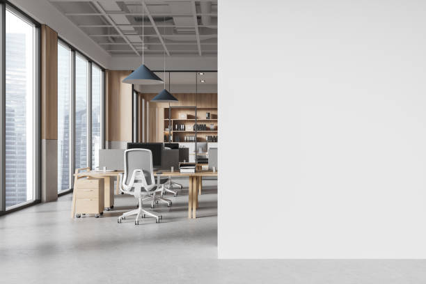 istock Office coworking interior with table and pc monitors, window. Mockup wall 2181593590