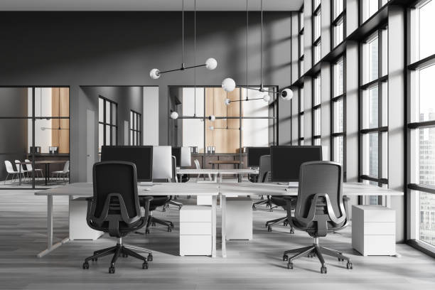 istock Contemporary open space office interior featuring large windows, sleek furniture, and a minimalist design. Bright and spacious business environment. 3D Rendering 2181594412