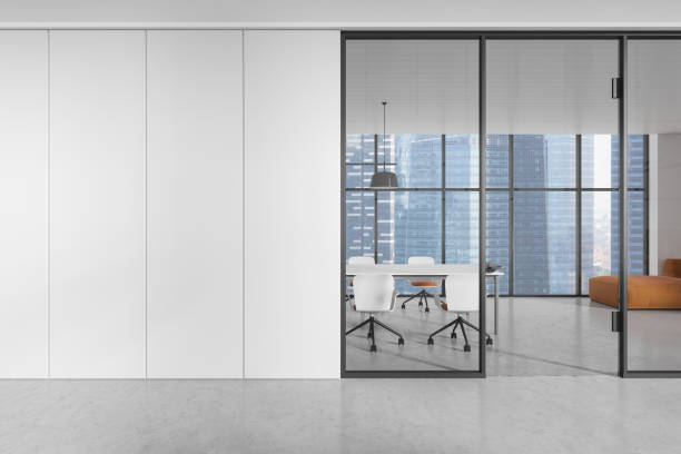 istock Modern office interior with blank white wall and glass partition. 3D Rendering 2181594636