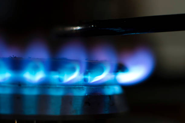 Burning gas burner extreme close-up on dark background