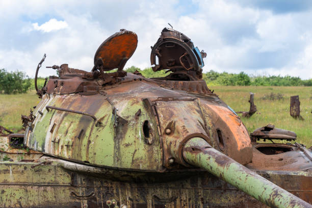 istock Rusty abandoned old Soviet tank on a grassy field 2181599504