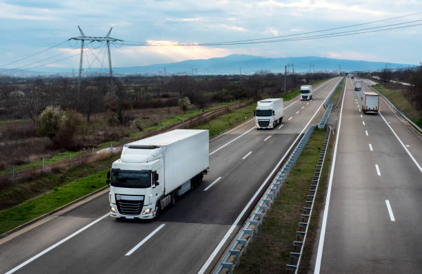 istock Convoys of white transportation trucks 2181602492