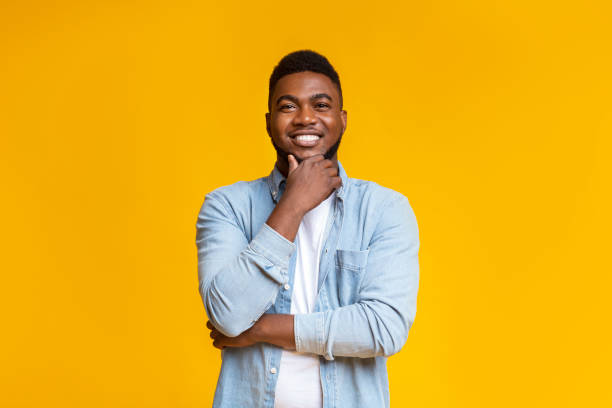 istock Portrait of handsome black guy touching his beard 2181604749