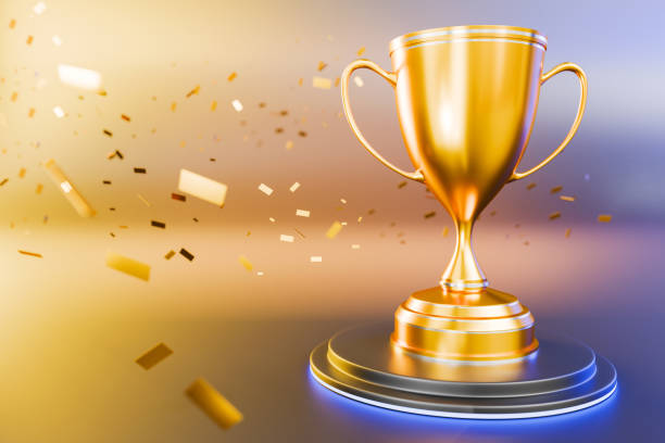 istock Gold cup or trophy on a golden light background as a reward Outstanding performance award Winners Cup Success Victory. Concept of goal achievement. Winner 3D illustration rendering 2181610901
