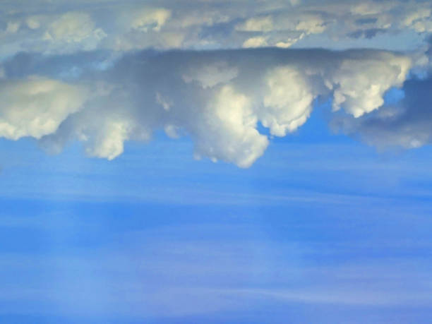 Big White Fluffy Clouds on A Blue Sky With Fine Whispy Lines