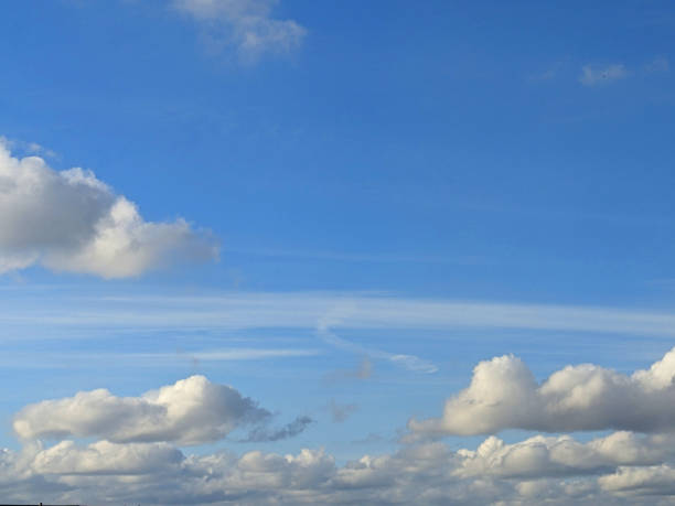 istock Big White Fluffy Clouds on A Blue Sky With Fine Whispy Lines 2181615505