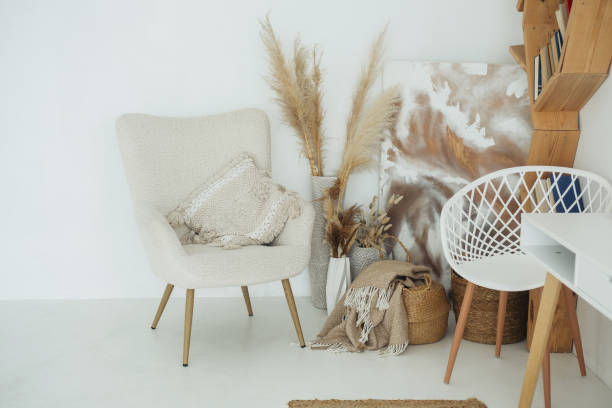 istock Cozy indoor space featuring a stylish chair, decorative art, and natural elements 2181622211