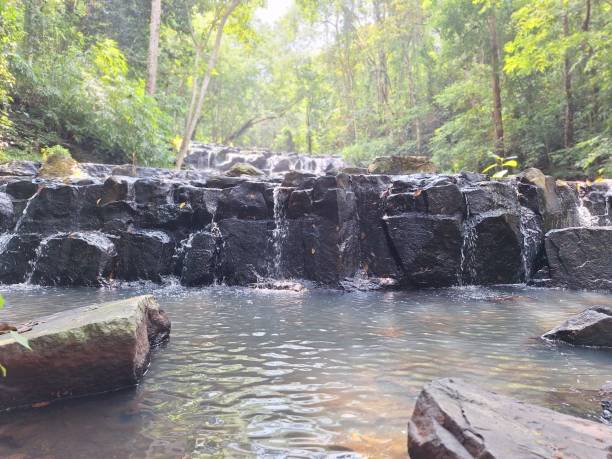 istock Blurred image of a waterfall in the forest 2181622458