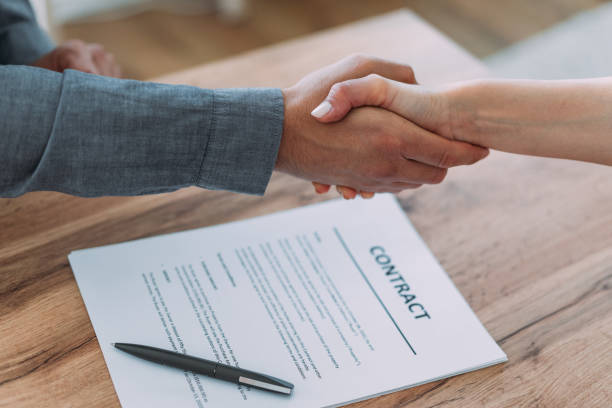 istock Business people signing a contract in the office. 2181634952
