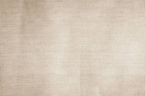 istock Brown sackcloth woven texture background in natural pattern. Jute hessian burlap, linen background in light beige cream color blank. Weaving canvas fiber line cotton cloth textured as organic. 2181635453