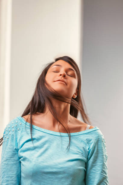 Young woman enjoying freedom and expressing confidence
