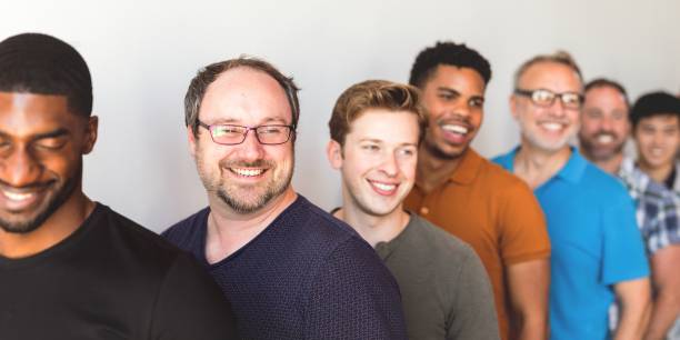 istock A diverse group of men standing in line voting in election. 2181646537