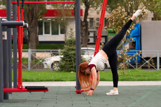 istock Woman performing leg lift stretch while bending forward 2181652322