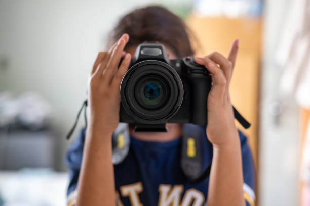 Selfie portrait with camera in mirror