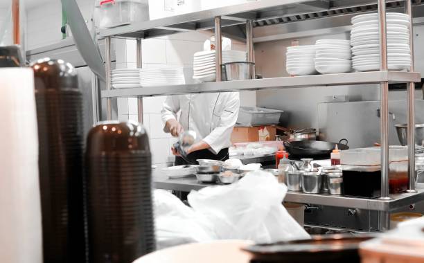 istock Restaurant Busy Kitchen, Chefs and Cooks Working on their Dishes 2181657294