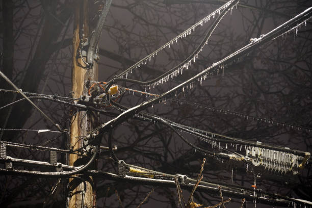 istock Power line in frozen rain at night 2181657768