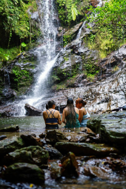istock Three women sitting in a river to stay cool 2181659717