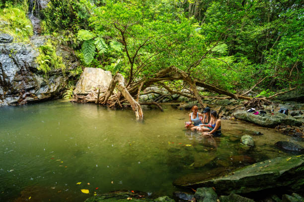 istock Three women sitting in a river to stay cool 2181659754
