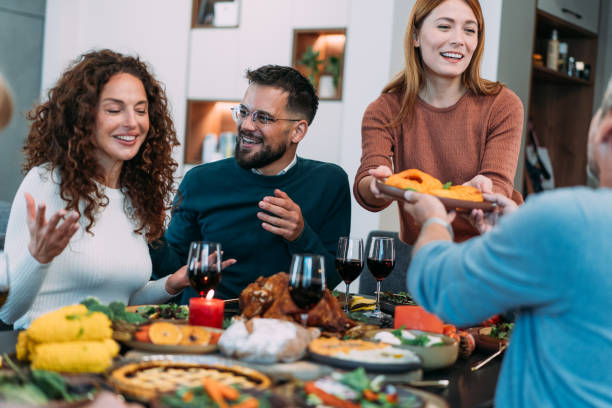 istock Happy extended family celebrating Thanksgiving at dining table. 2181662970