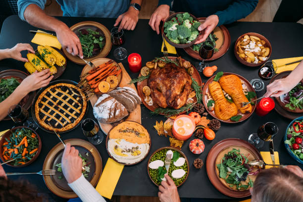 istock Happy family celebrating Thanksgiving at dining table. 2181662988