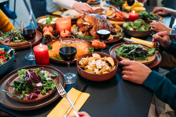 istock Happy family celebrating Thanksgiving at dining table. 2181662989