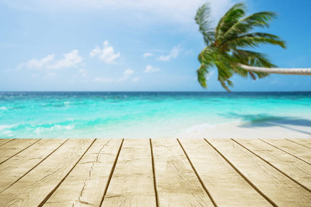 istock Empty wooden table top with beautiful tropical turquoise sea and coconut palm tree background 2181664083
