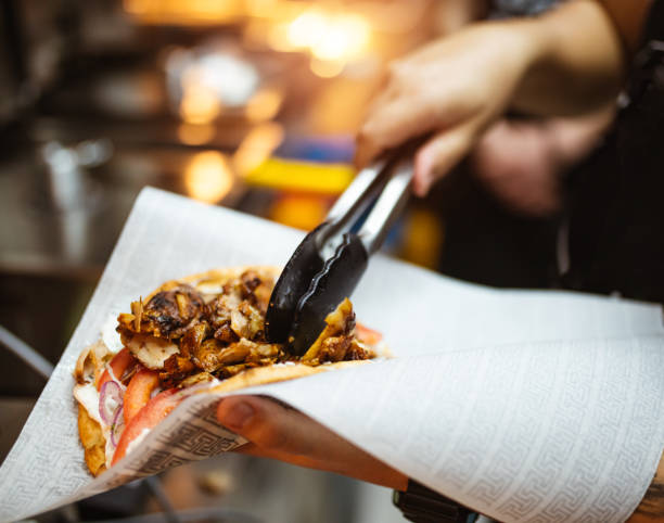 istock Service worker preparing gyros pita 2181664114