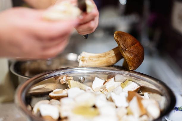 Fresh mushrooms being chopped and prepared in the kitchen