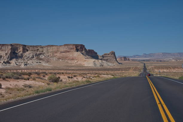 istock Open road through the desert landscape 2181666009