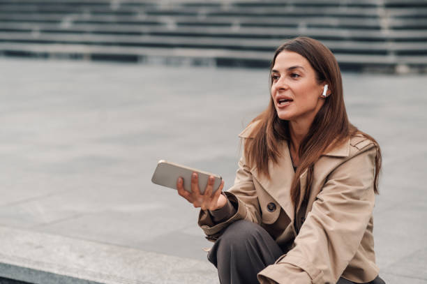 istock Businesswoman recording voice message using smartphone app 2181666231