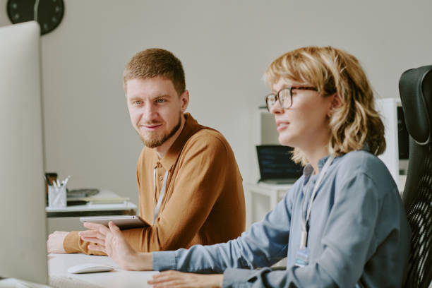 istock Young Man and Woman Working on Computer in IT Office 2181669186