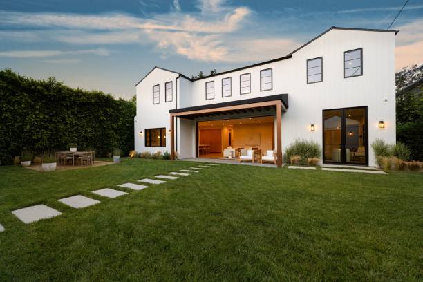 istock Modern white house with spacious lawn. 2181669196