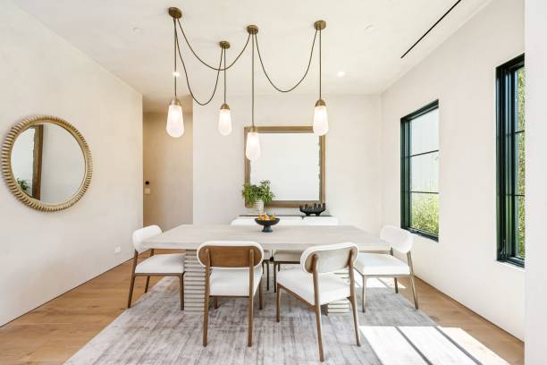 istock Modern dining room with pendant lights and minimalist decor. 2181669200