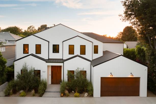 istock Modern suburban white house at sunset. 2181669227
