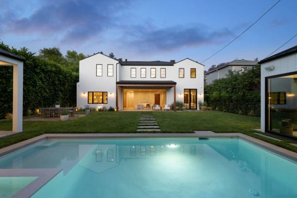 istock Modern house with pool and garden at twilight. 2181669275