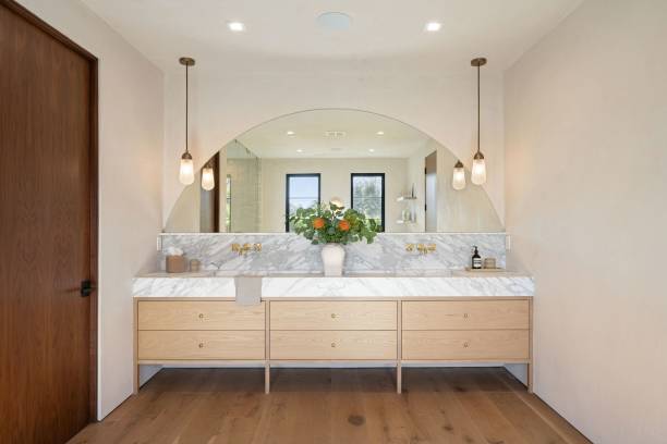 istock Modern bathroom with marble and wood accents. 2181669278