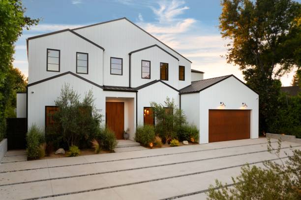 istock Modern white house with wooden accents. 2181669281