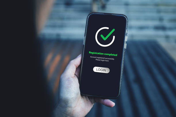 istock Smartphone screen shows Registration completed with Log in to proceed to the next step. 2181669389