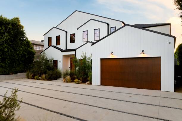 istock Modern white house with wooden garage. 2181671718
