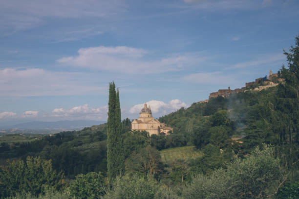 Basilica on hillside in rural landscape, Tuscany