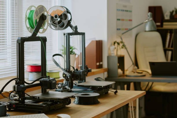 istock Highlighting Dual 3D Printers on a Wooden Desk 2181680373