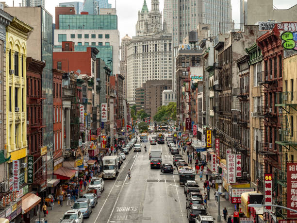 View down Centre Street in Lower Manhattan, the street is a part of the local Chinatown, with signs in Chinese together with the American architecture