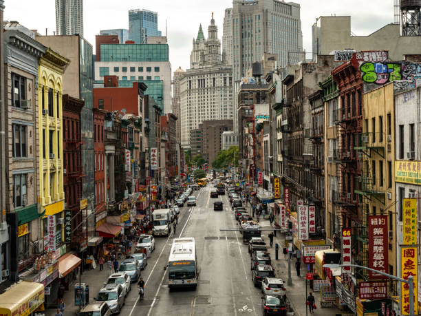 View down Centre Street in Lower Manhattan, the street is a part of the local Chinatown, with signs in Chinese together with the American architecture