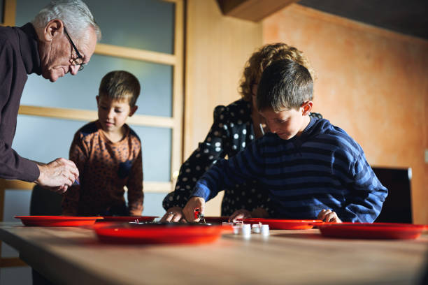 grandparents spend time with their grandchildren at home