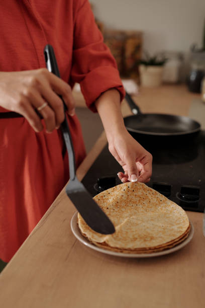 istock Preparing Crepes on Kitchen Counter with Frying Pan 2181683554