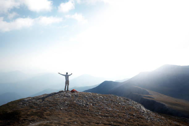 Lonely hiker on the mountain peak