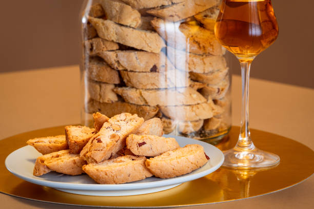 istock Almond cantucci biscuits in focus with Vin Santo and jar blurred in background creating stylish bokeh 2181688654