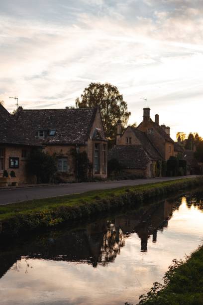 istock Stone cottages by a canal at sunset. 2181691243