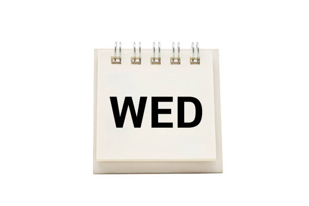 WED text on desk calendar with clipping path isolated on white background. WEDNESDAY and Calendar concept
